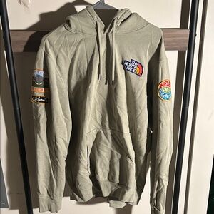 The North Face Sage Green Hoodie with Vibrant Patches